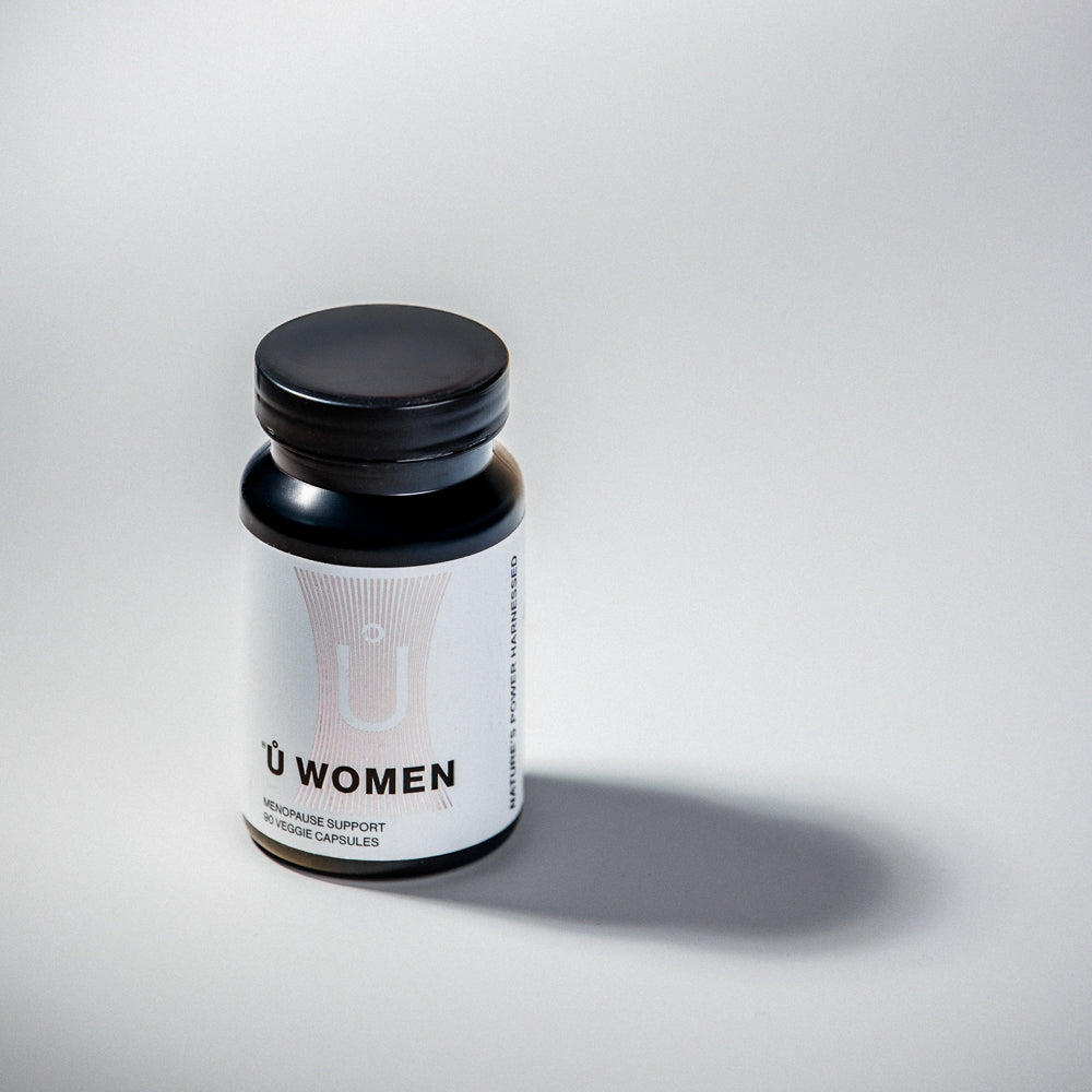 White bottle of Ů GEN Ů WOMEN dietary supplement capsules, 100% vegan and no pill fillers.