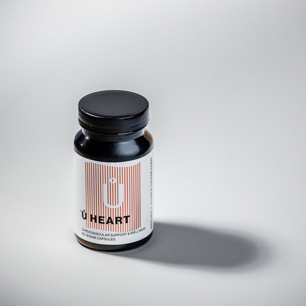Ů HEART supplement bottle featuring plant-based ingredients for a daily wellness routine.