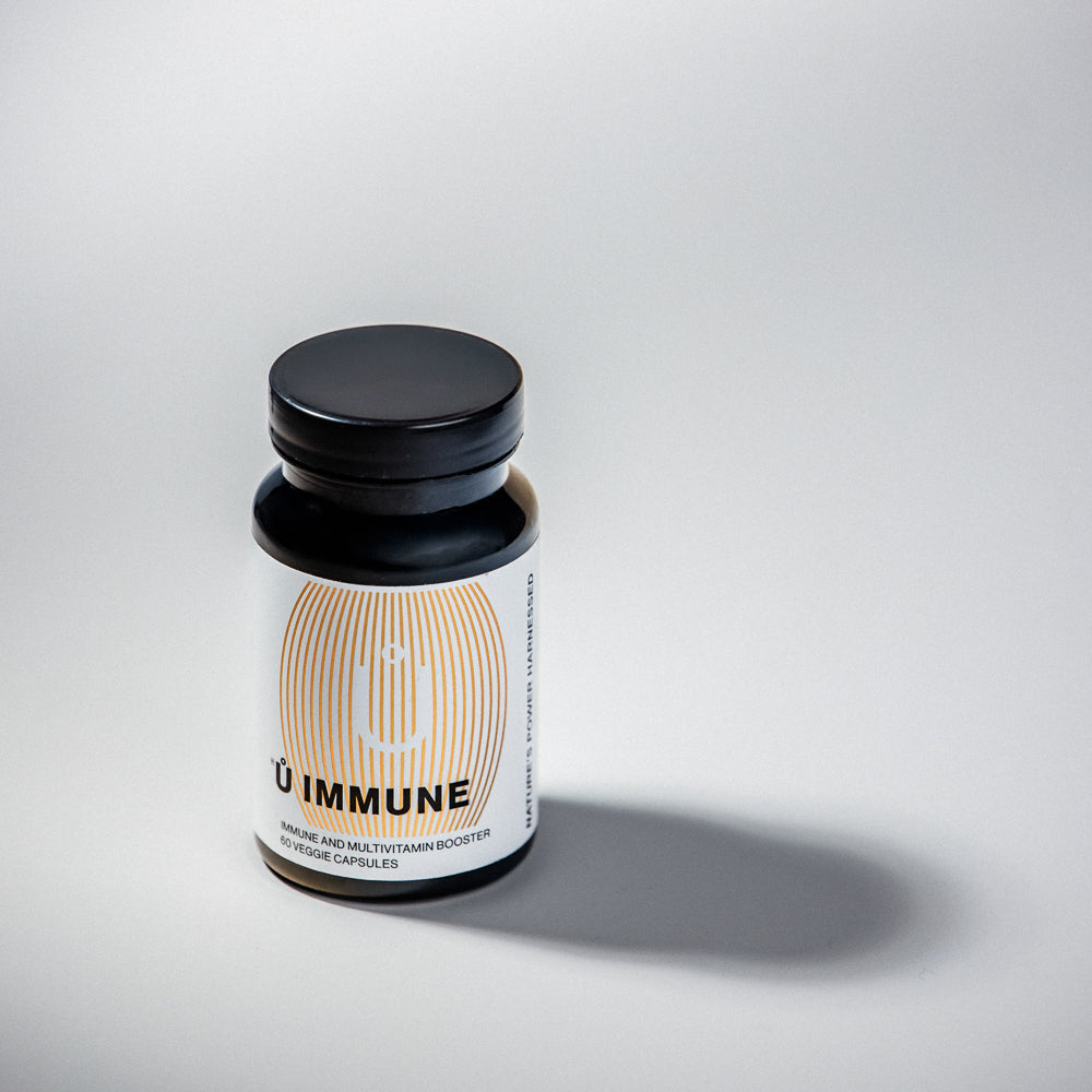 Ů IMMUNE dietary supplement featuring vitamins, minerals, and botanicals.