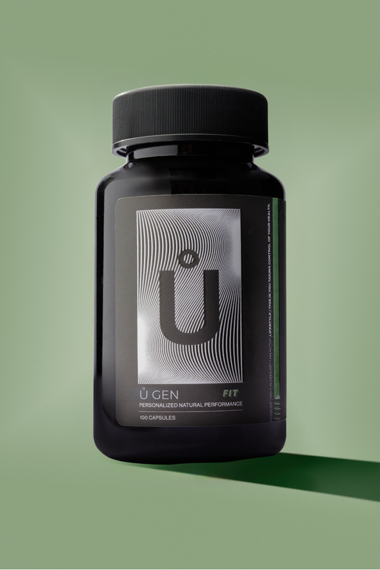 A black bottle with a silver label, featuring the text 'Š FIT'. The bottle is presented against a green background.