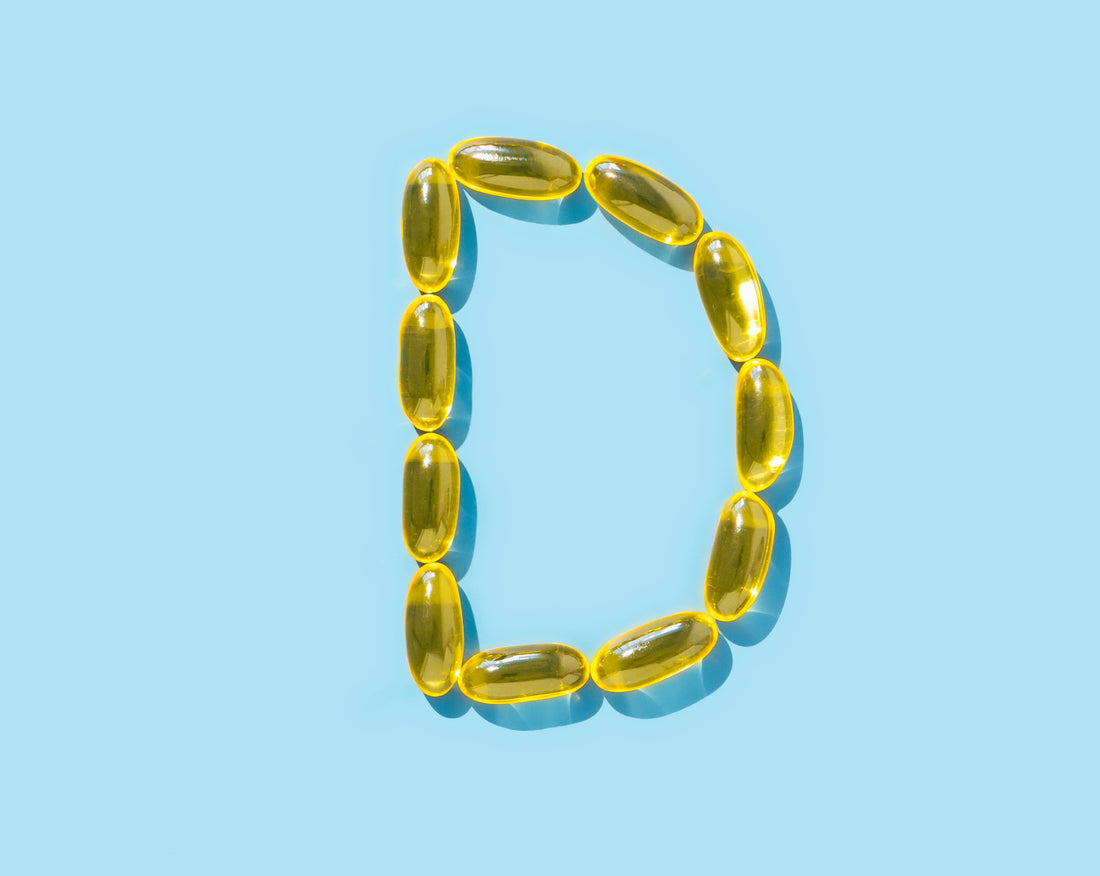 An image showing Vitamin D Supplements arranged in the shape of a D.