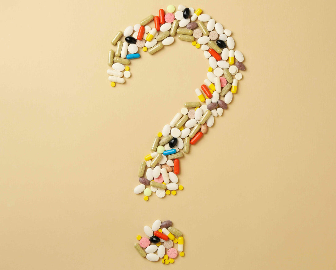 A photo of a question mark made out of vitamin supplements for a guide to vitamin and herbal supplement FAQs.
