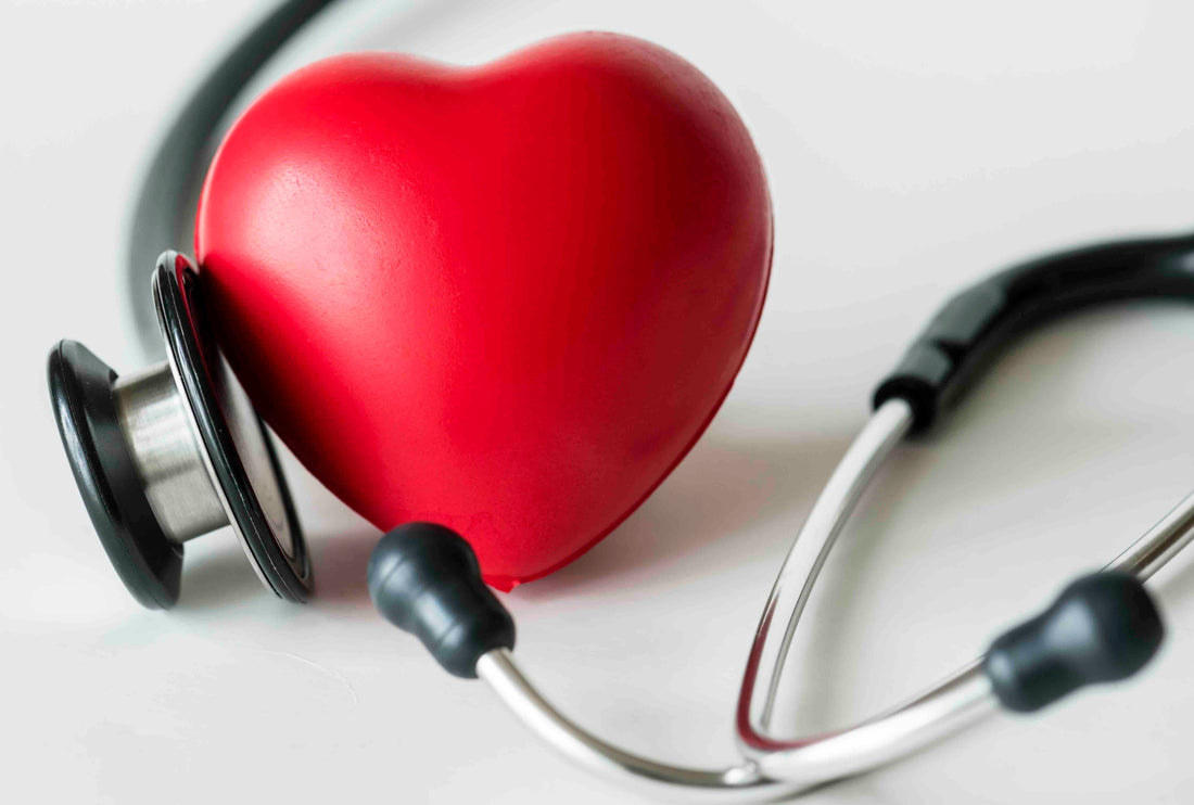 A photo of a heart and a stethoscope representing howe L-Theanine helps reduce stress and boost heart health.